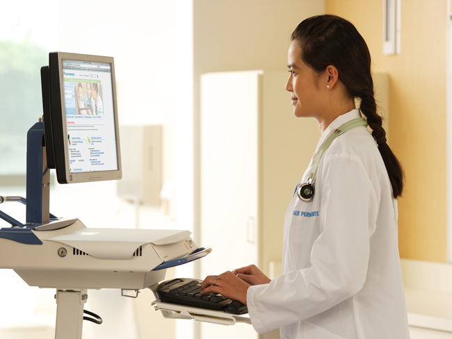 Physician working at computer station